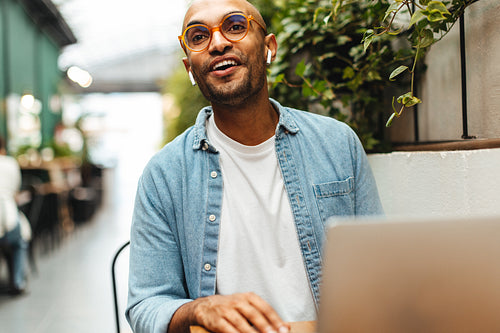 Business man calling for the waitress in a cafe