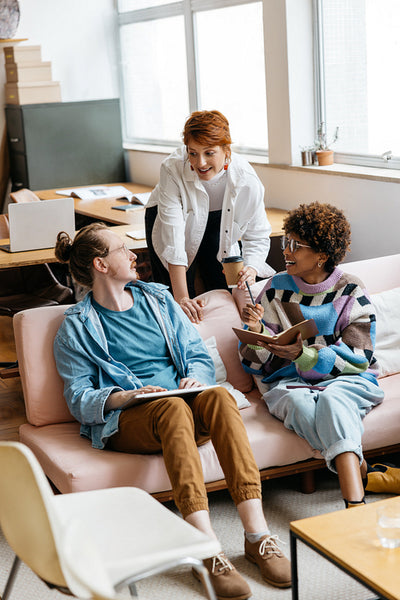 Colleagues collaborating in a modern freelance office space