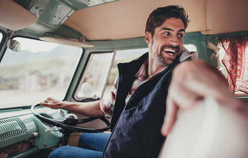 Handsome man enjoying his road trip