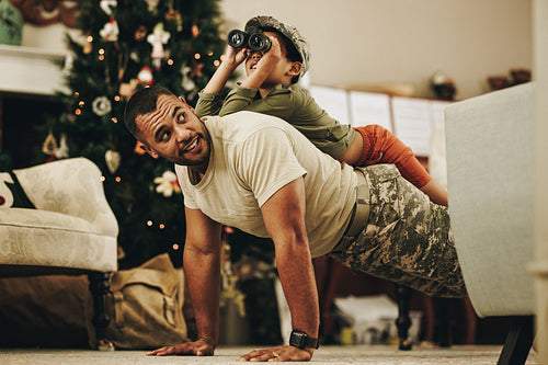 Happy military dad spending quality time with his son