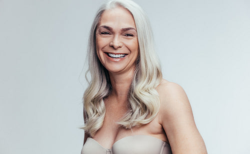 Cheerful mature female in lingerie