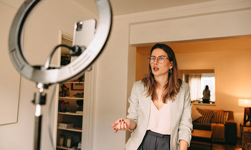 Influencer recording content for her social media channel