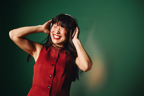 Embracing music: A joyful moment with headphones