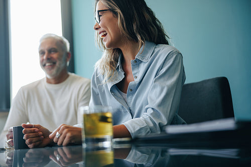Happy business colleagues engaged in a discussion during a meeting