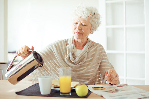 Senior Woman Having Breakfast