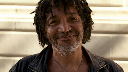 Homeless man with dreadlocks and greying beard