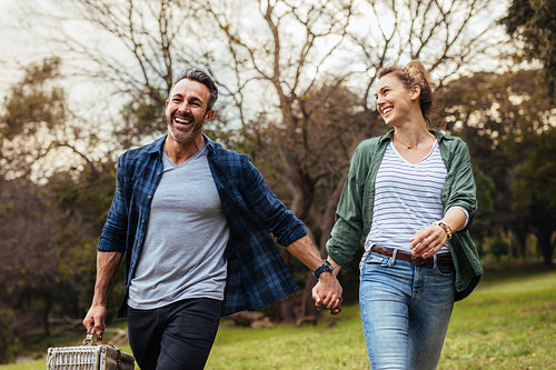 Loving couple going on a picnic at the park