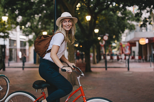 Woman riding bicycle in city