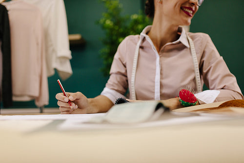 Woman dressmaker working in her studio