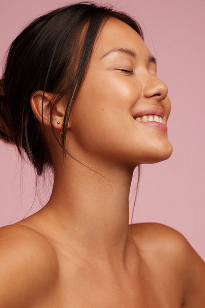 Happy young asian model with perfect skin