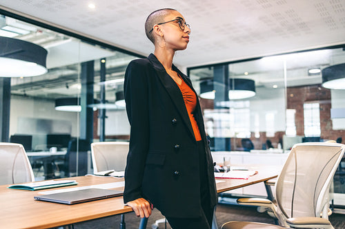 Young businesswoman looking thoughtful in a boardroom