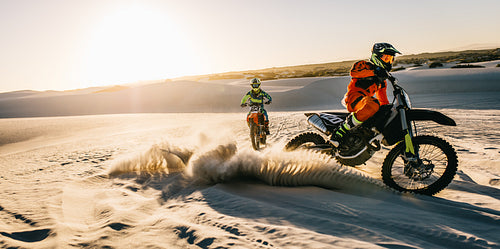 Racing dirt bikes in sand