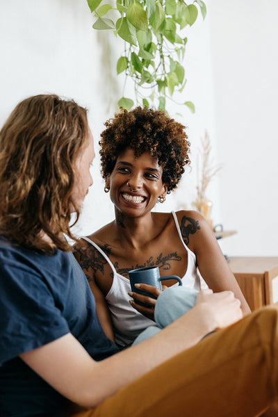 Intimate moment of a couple enjoying morning coffee