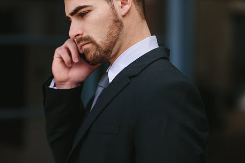 Businessman talking over mobile phone
