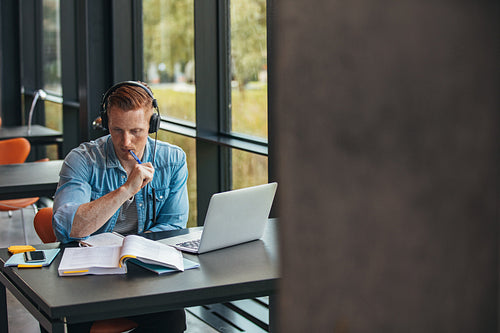 Student preparing assignment in university library
