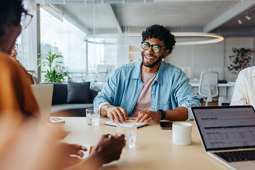 Young professionals collaborating on a business project in a modern office