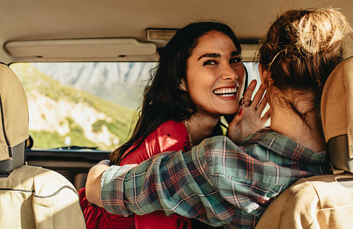 Loving couple in a car on holiday