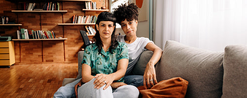 Married lesbian couple sitting together