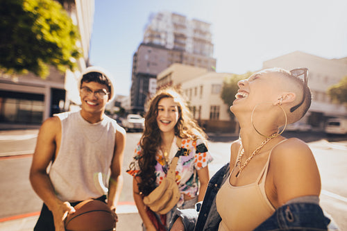 Three friends having a good time together outdoors
