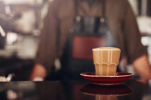 Coffee cup with saucer on cafe counter