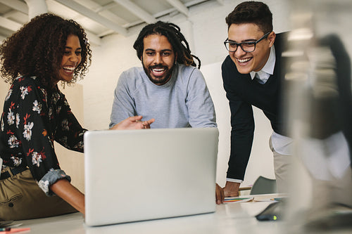 Business people taking a break from work  sharing lighter moments