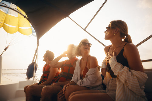 Group of friends enjoying parasailing adventure on a holiday trip