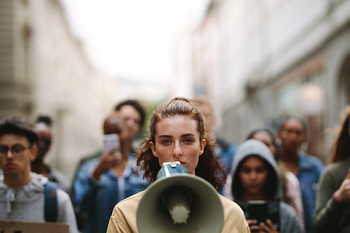 People on strike protesting with megaphone