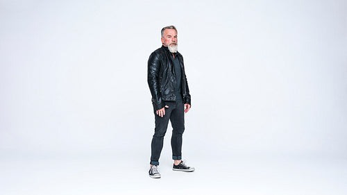 Old man standing looking at camera