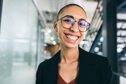 Businesswoman smiling at the camera cheerfully