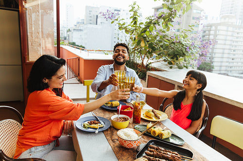 Family enjoying an outdoor meal together on a patio