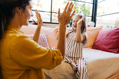 Family high five at home