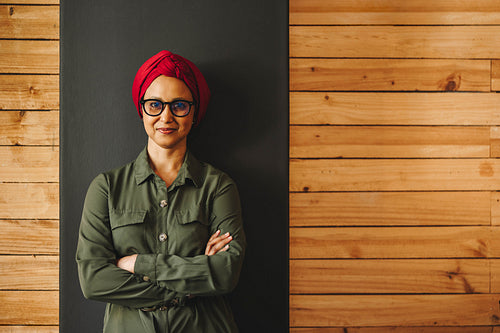 Confident businesswoman wearing a headscarf in an office