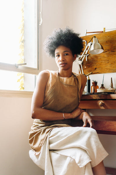 Woman artist in jewelry designing studio