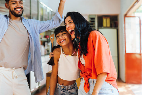 Happy family spending quality time together in a bright home kitchen setting