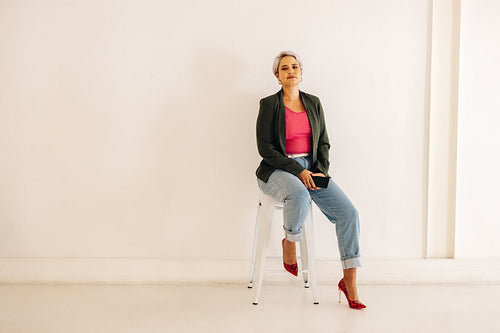 Businesswoman sitting on a chair in a modern office