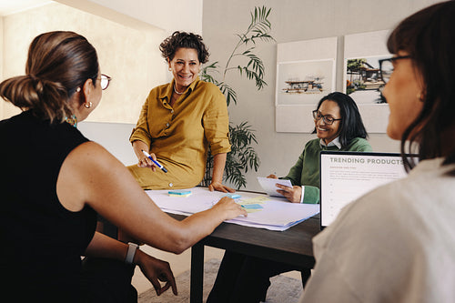 Professional women collaborating during a meeting in a modern office space