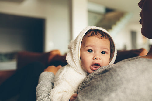 Innocent little boy on his mother's chest
