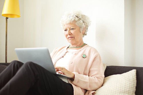 Retired Senior Woman Working on Her Laptop