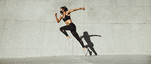 Sporty woman doing running workout