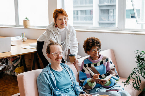Creative professionals working together in modern co-working space