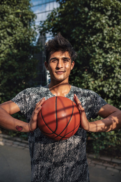 Young basketball player holding a ball