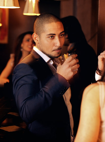 Party Guy Holding a Glass of Whiskey