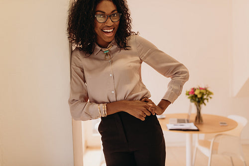 Businesswoman standing at home and posing  for photograph