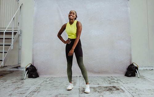 African woman taking a break from workout