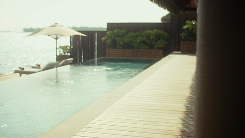 Tropical vacation morning: Joyful family breakfast at private Maldives villa with kids by the pool