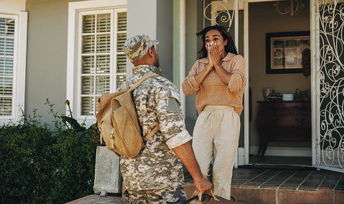 Soldier surprising his wife with his homecoming