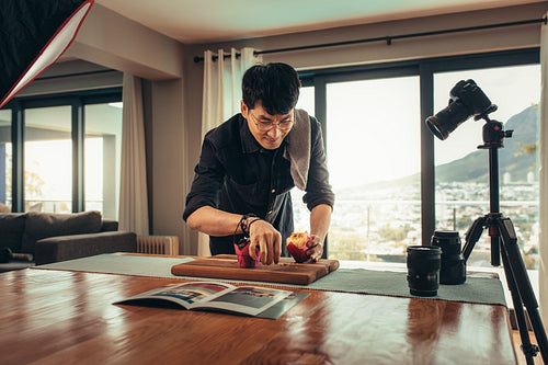 Photographer making a video blog on food photography