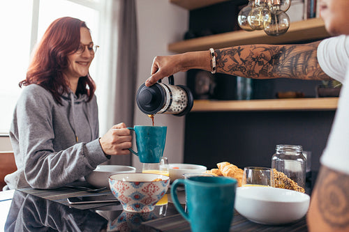 Loving couple having breakfast together