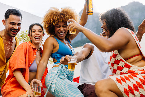 Group of friends dancing outdoors during summertime in Rio de Janeiro