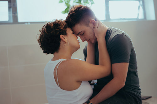 Two queer lovers sharing an intimate moment